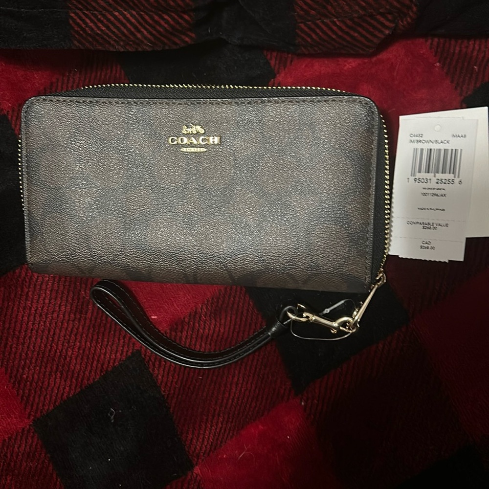 Brand new Coach wrist wallet with tags